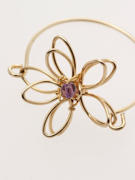 Anillo de flores de metal con piedras preciosas